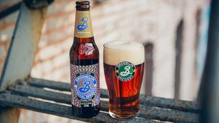 Bottle of Brooklyn Brewery Special Effects next to glass filled with the non-alcoholic beer