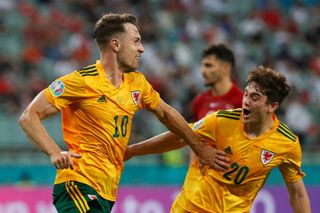 Aaron Ramsey and Daniel James celebrate a goal for Wales against Turkey at Euro 2020.