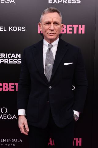 Daniel Craig, standing solo on the pink carpet, at Macbeth.
