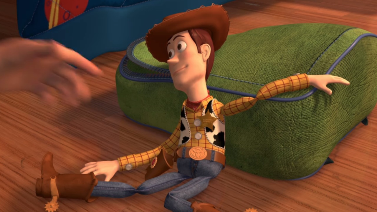 Woody laying on the floor waiting to be picked up by Andy