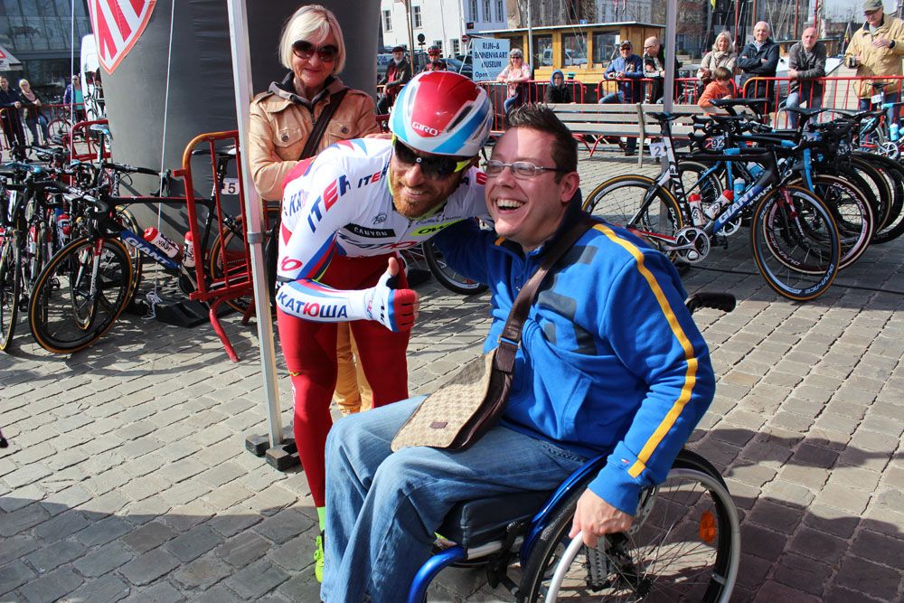Luca Paolini takes a photo with a fan