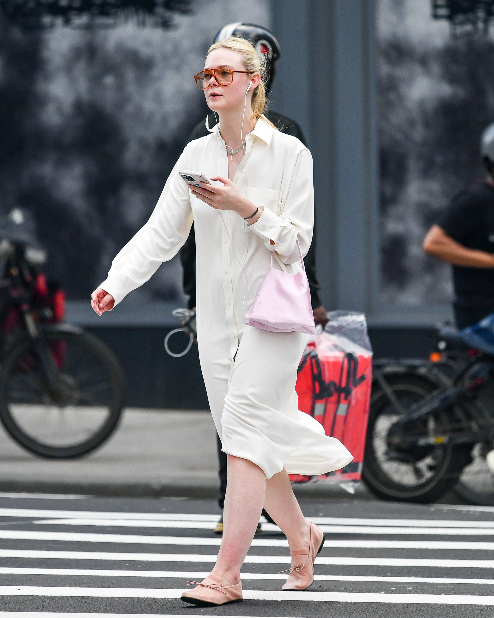 Elle Fanning styled her mesh Mary Jane shoe trend with a pale pink bag.