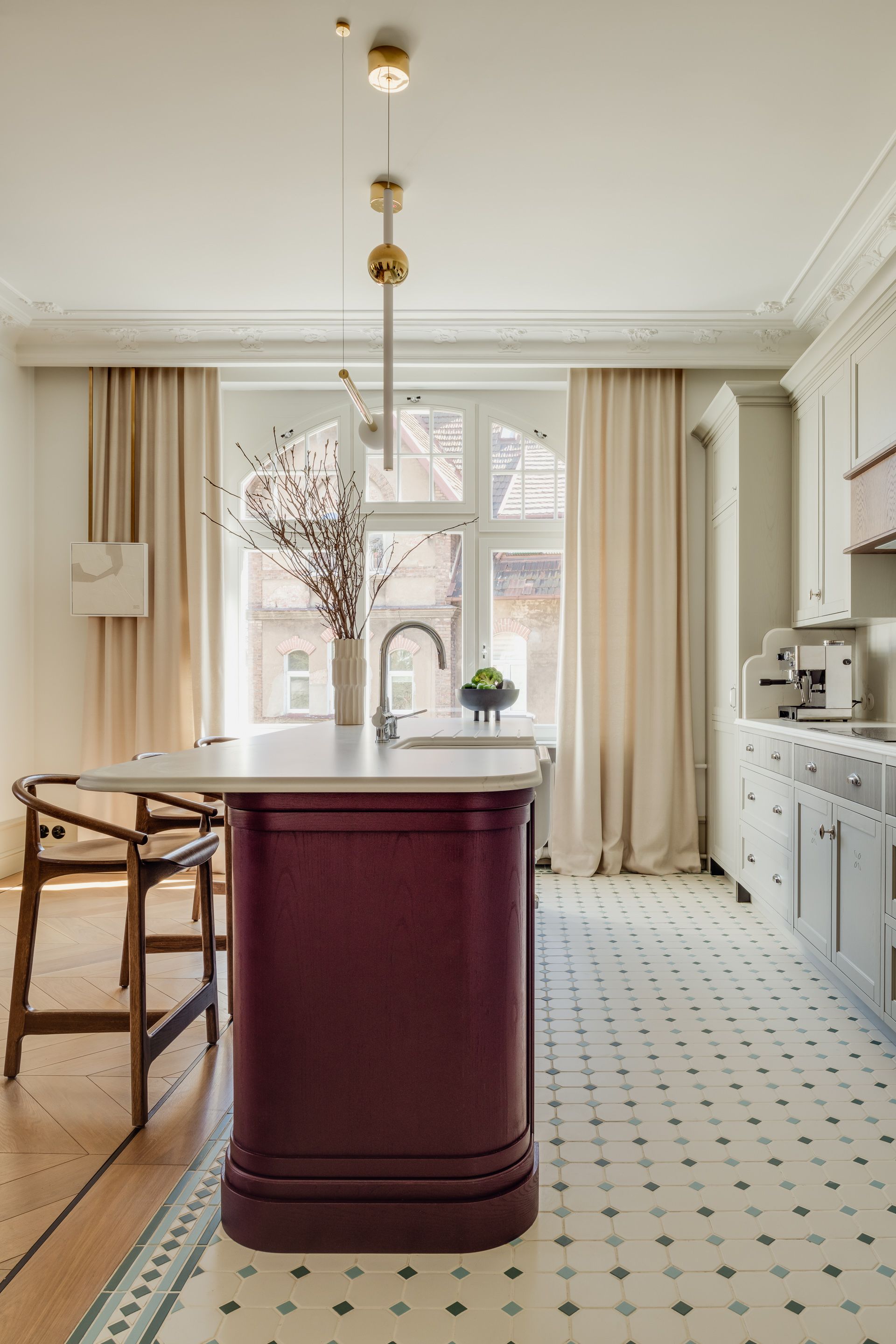 A kitchen with a rounded edge island