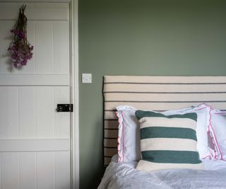 calming bedroom with green wall