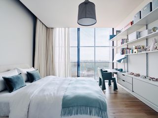 red rock house bedroom with a large window and nature views