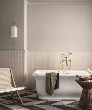 A neutral bathroom with marble floor tiles