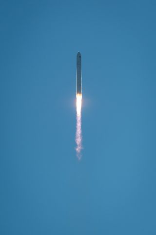 Antares Rocket Soars in Clear Blue Sky