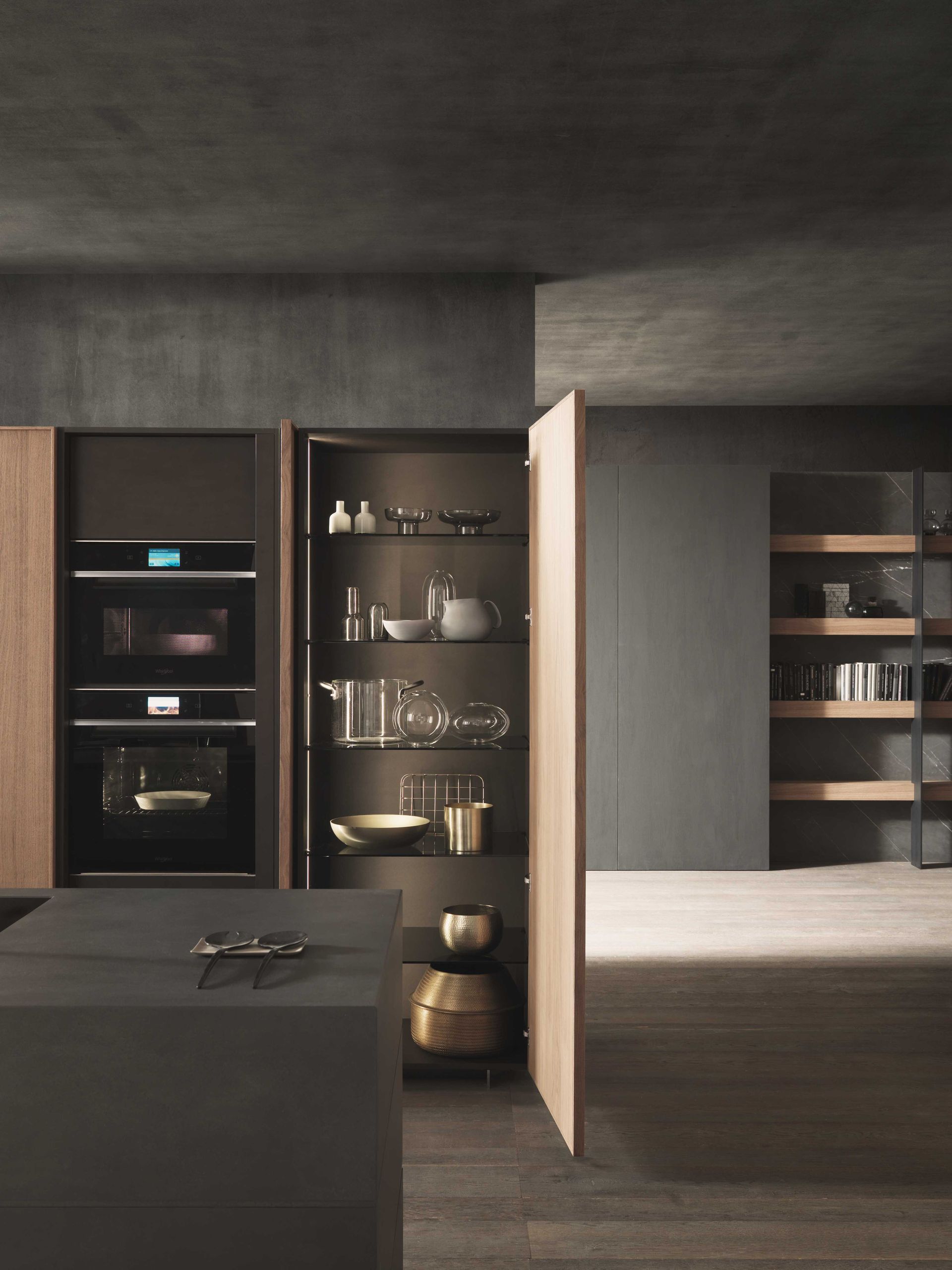 Kitchen with wood cabinets and floor and island