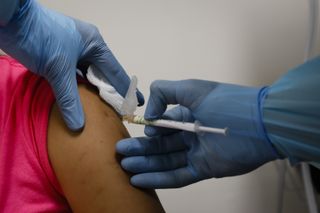 A person receives the Pfizer COVID-19 vaccine as part of the phase 3 clinical trial.