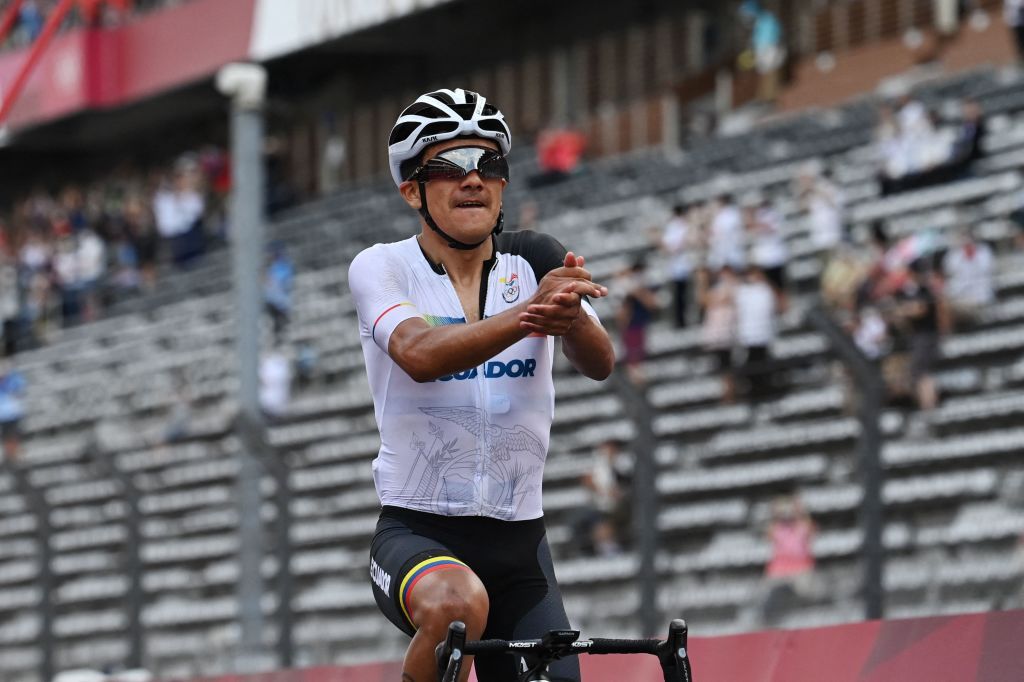 Ecuadors Richard Carapaz celebrates after crossing the finish line to win the mens cycling road race during the Tokyo 2020 Olympic Games at the Fuji International Speedway in Oyama Japan on July 24 2021 Photo by Greg Baker AFP Photo by GREG BAKERAFP via Getty Images
