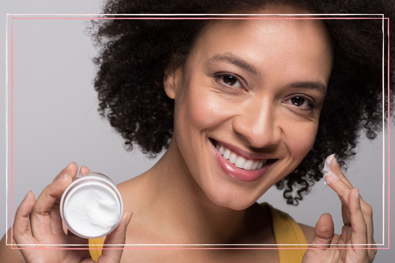 woman moisturising her face as part of her winter skincare tips