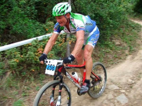 Giuseppe Zamparini (Italy) rides toward third in the men's 50-54 race.