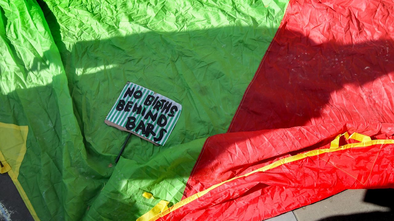 A protest slogan on a parachute at the demonstration outside the Royal Courts of Justice calling for an end to the incarceration of pregnant women