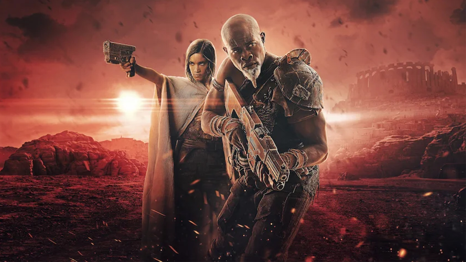 A promotional image for Rebel Moon Chapter One: Chalice of Blood, which shows Kora and Titus holding guns