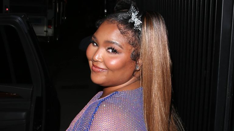 Lizzo is seen in a blue sheer dress on October 12, 2021 in Los Angeles, California