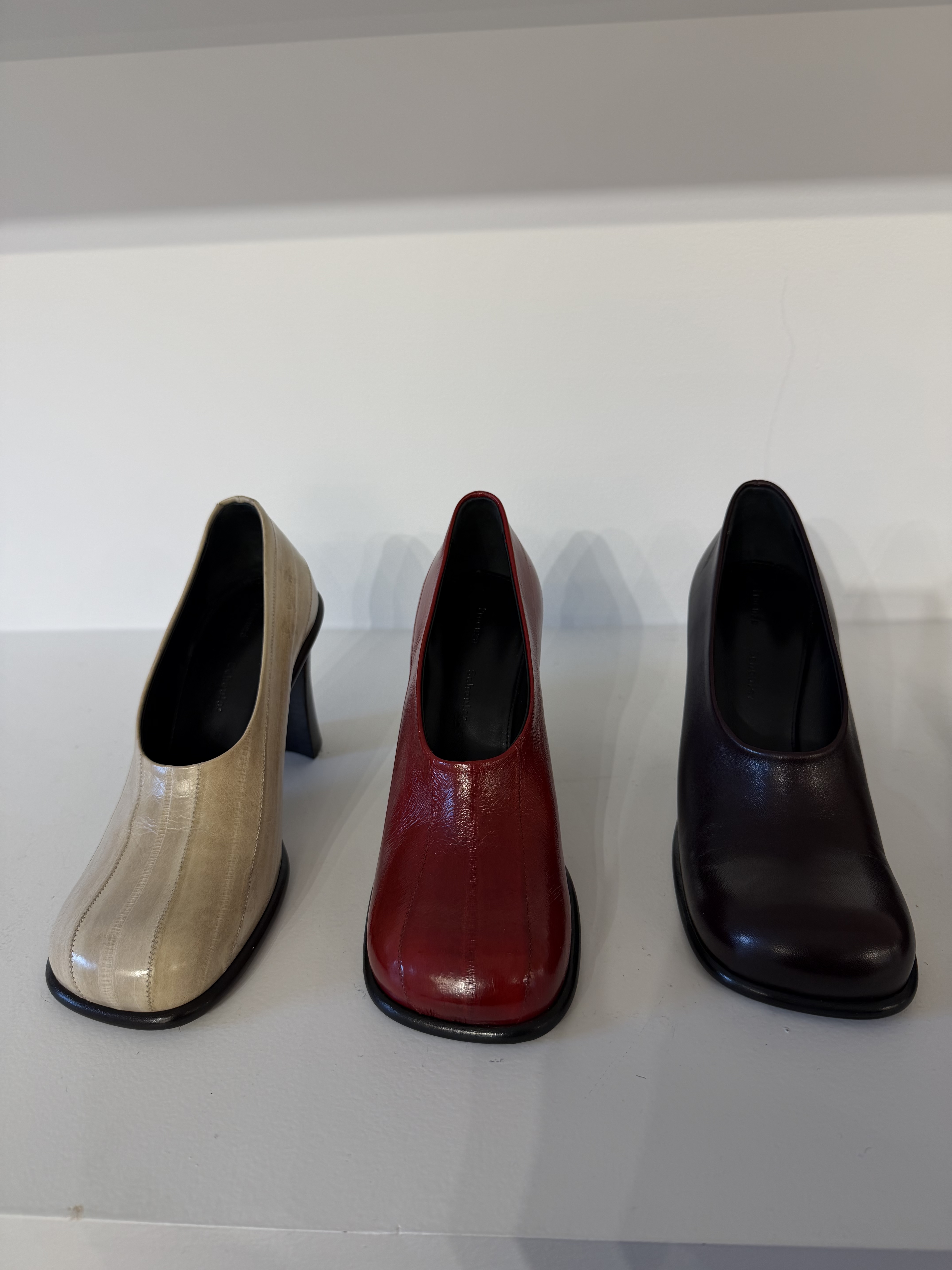 three pairs of eel-printed high-vamp Proenza Schouler pumps