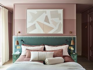 Bedroom designed by Irene Gunter with pink walls and blue headboard