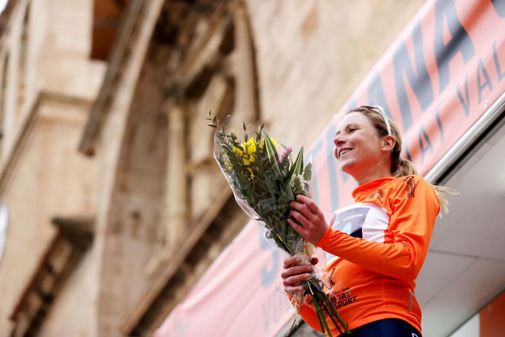 VISTABELLA DEL MAESTRAT SPAIN FEBRUARY 19 Annemiek Van Vleuten of Netherlands and Movistar Team celebrates winning the orange leader jersey on the podium ceremony after the 6th Setmana Ciclista Valenciana Vuelta Comunidad Valenciana Feminas 2022 Stage 3 a 135km from VilaReal to Vistabella del Maestrat 1245m VoltaCVFemines22 on February 19 2022 in Vistabella del Maestrat Spain Photo by Gonzalo Arroyo MorenoGetty Images