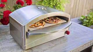 Camp Chef Italia Artisan Pizza Oven cooking pizza