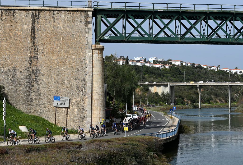 TAVIRA PORTUGAL FEBRUARY 17 A general view of the peloton passing through Feder City during the 49th Volta ao Algarve em Bicicleta 2023 Stage 3 a 2031km stage from Faro to Tavira VAlgarve2023 on February 17 2023 in Taviria Portugal Photo by Tim de WaeleGetty Images