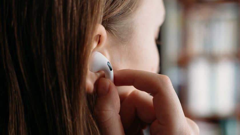 Close up of lady wearing a pair of Apple AirPods 