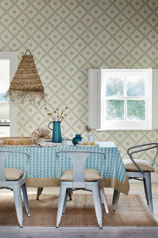 dining room with a country style wallpaper featuring repeating pattern