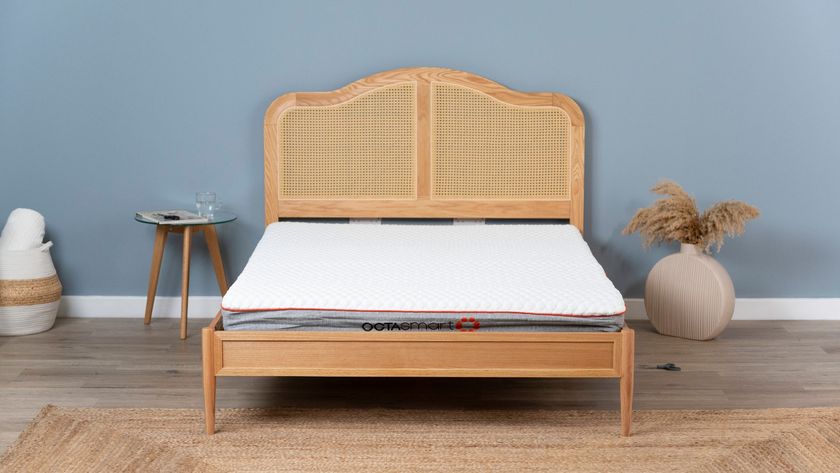 A cheap mattress on a bed frame