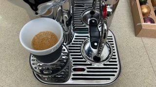 Nespresso Vertuo Creatista with a cup of bubbly crema