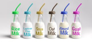 bottles with different milk alternatives including oat milk