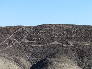 The geoglyph was marked out more than 2,000 years ago by removing a thin layer of stones in some places and piling up stones in others.