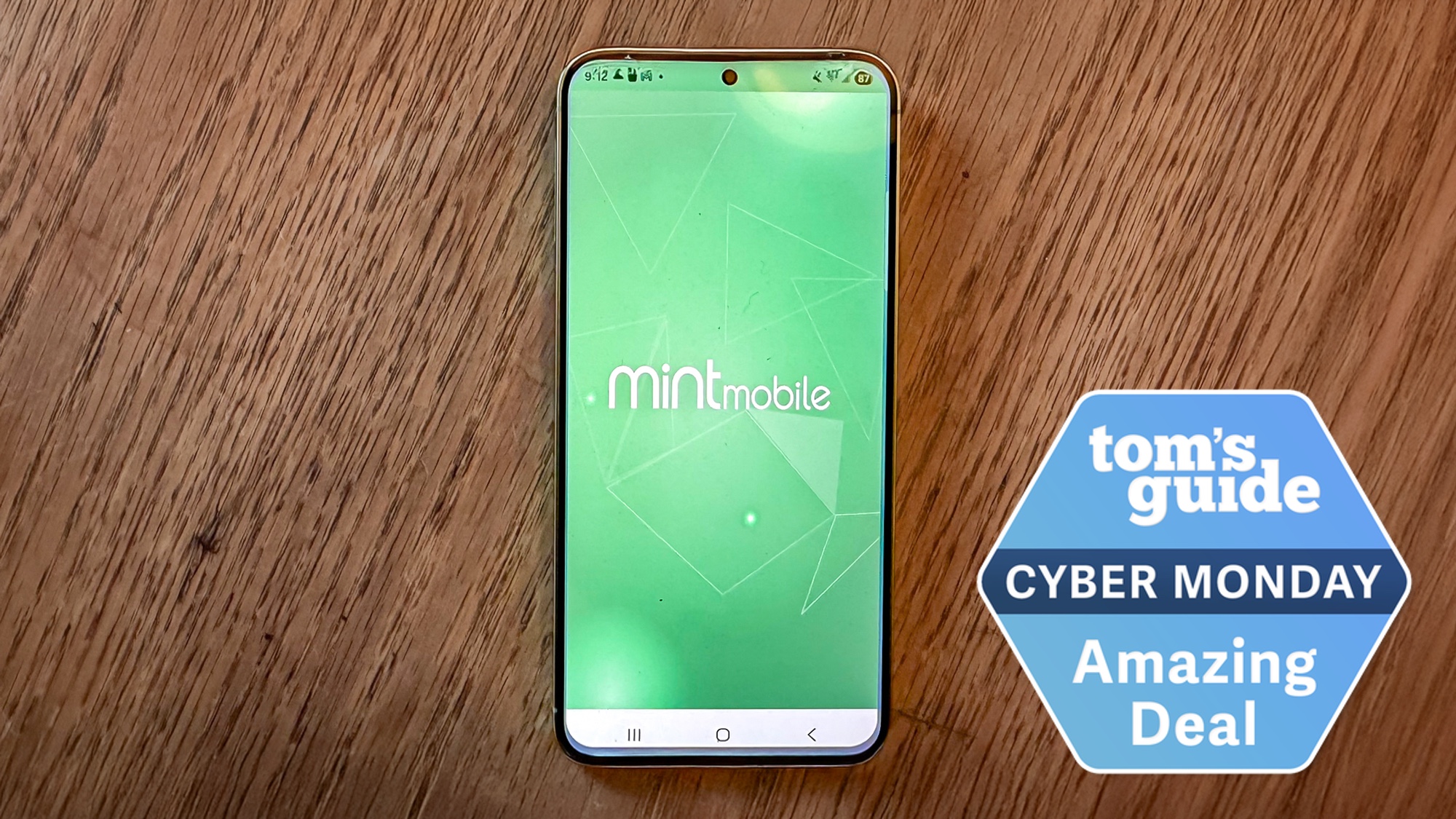 Phone with Mint Mobile app and cyber monday logo