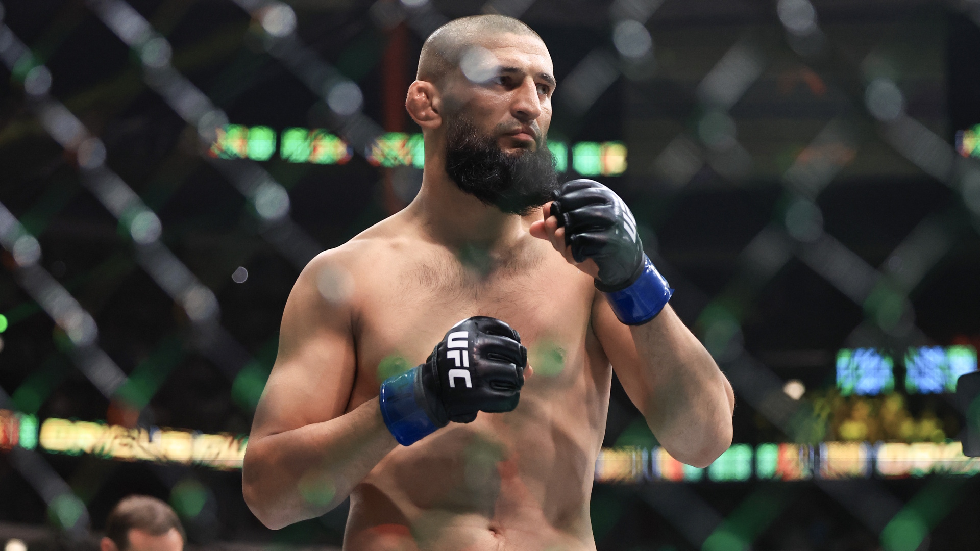 Khamzat Chimaev in the Octagon during a UFC bout.