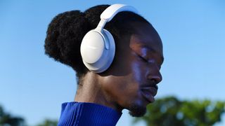 Man wearing Bose QuietComfort Ultra Headphones.