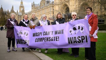 A group of women representing the Waspi protest group stand outside the Houses of Parliament 