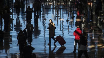 A traveller walks through an airport