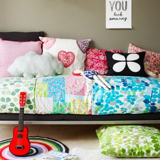 children bedroom with colourful fabrics and duvet cover