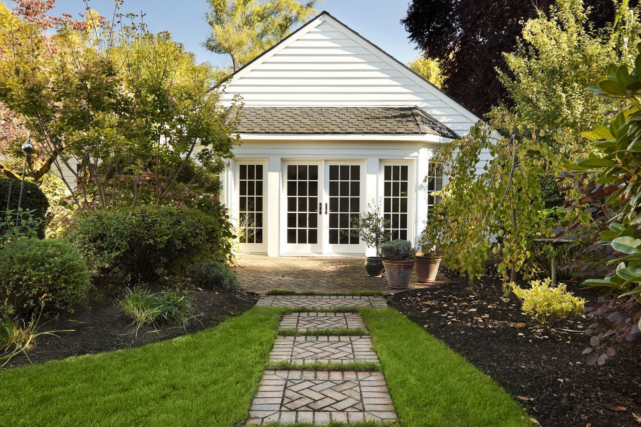 Cute cottage home with landscaped backyard.