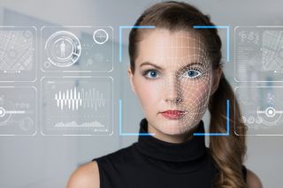 Woman having her face scanned