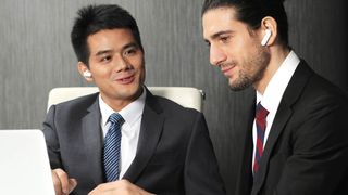 Timekettle WT2 Edge translator earbuds at use in a meeting