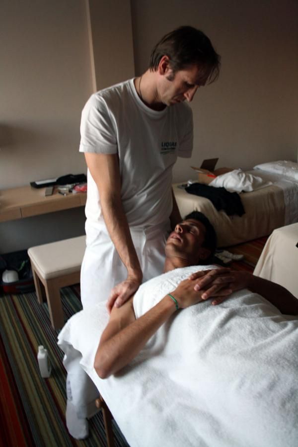 Eros Capecchi gets a massage as jazz plays quietly in the background