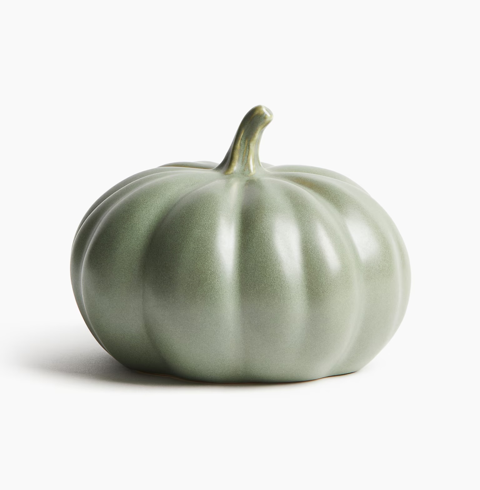 a green decorative pumpkin