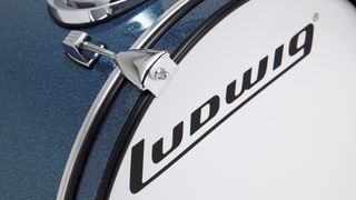 Close up of the front bass drum head and Ludwig logo on the Ludwig Breakbeats kit in Grey/Blue sparkle