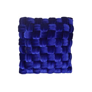A blue velvet cushion