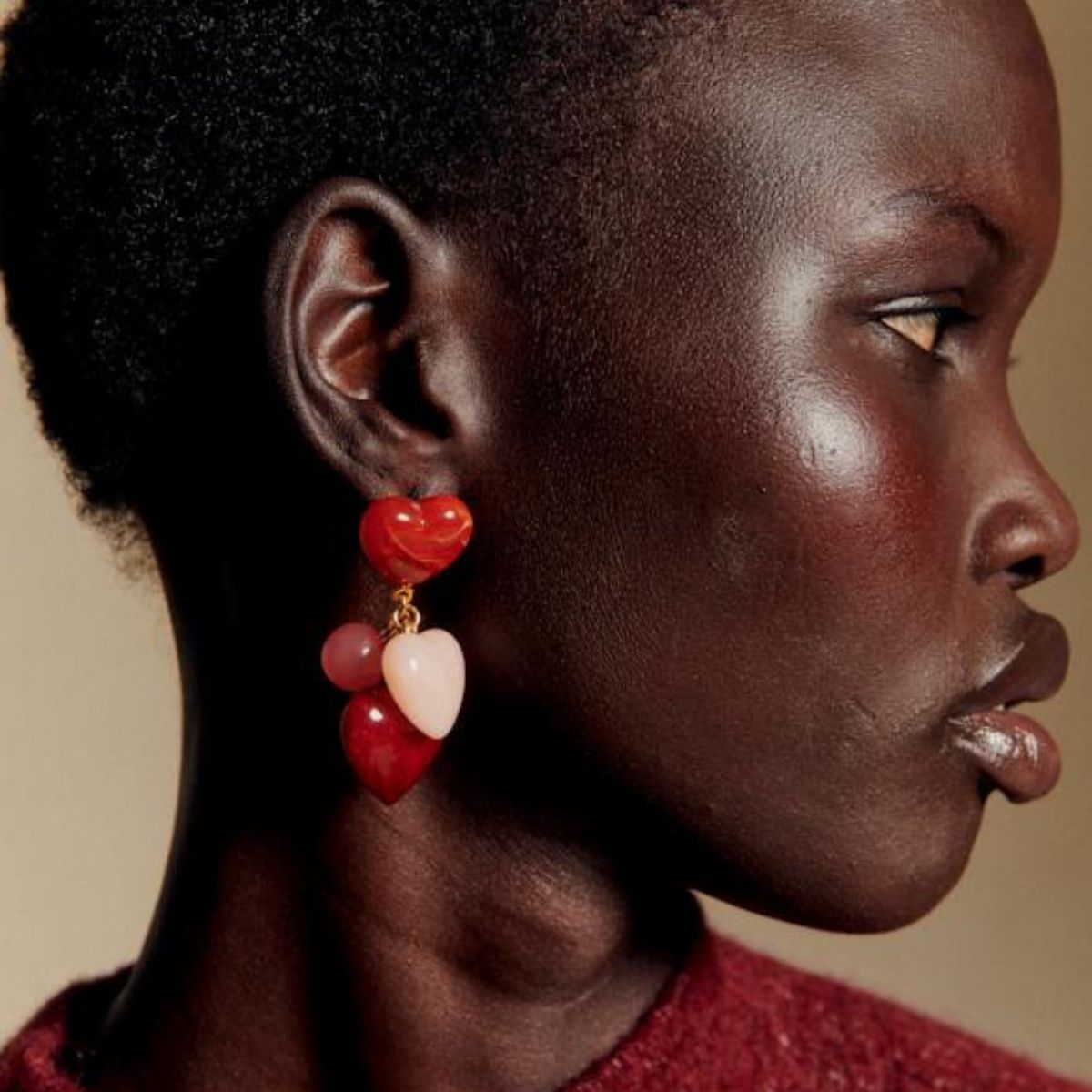 a model wearing heart earrings from sezane