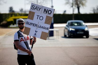 Fan protesting the formation of a European football Super League.