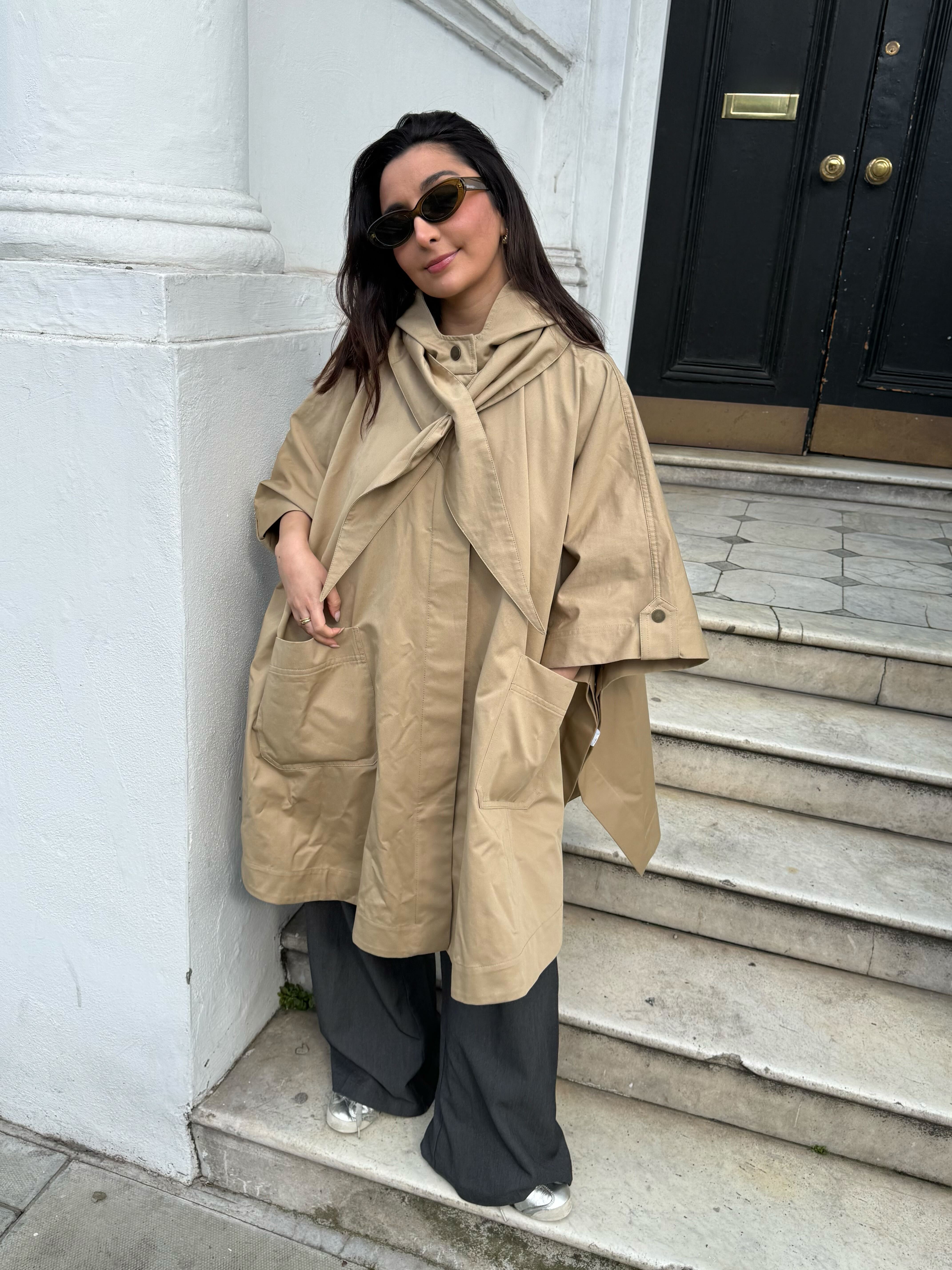 An image of Who What Wear UK senior shopping editor Marina Avraam wearing a S&amp;eacute;zane raincoat.