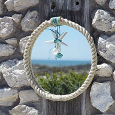 seaside mirror with stone wall and rope framed