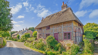 Exterior of a timber thatched cottage