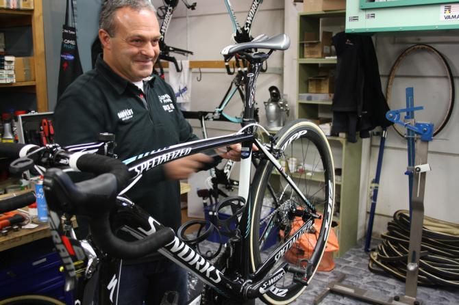 A team mechanic strips down one of the bikes from Gent-Wevelgem