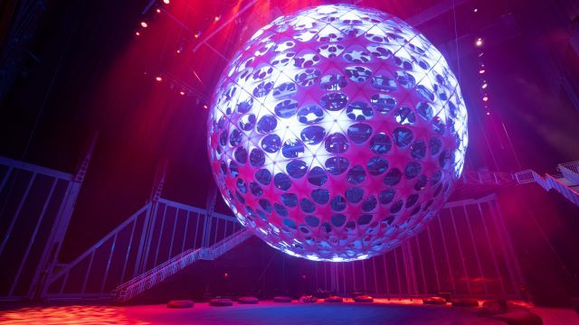 The Sonic Sphere, suspended in air, is illuminated in multiple colors immersing guests in an Avant-Guard experience.